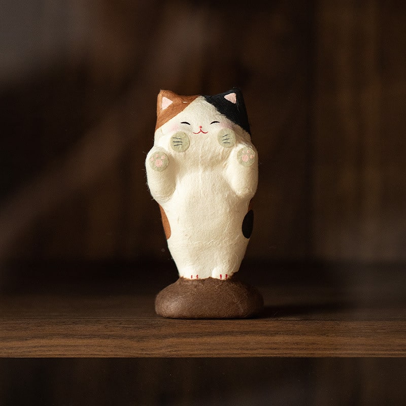 Close-up of a Japanese ceramic cat home décor piece