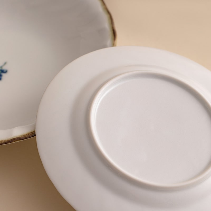 Artistic underglaze Japanese deep plates for versatile dining.