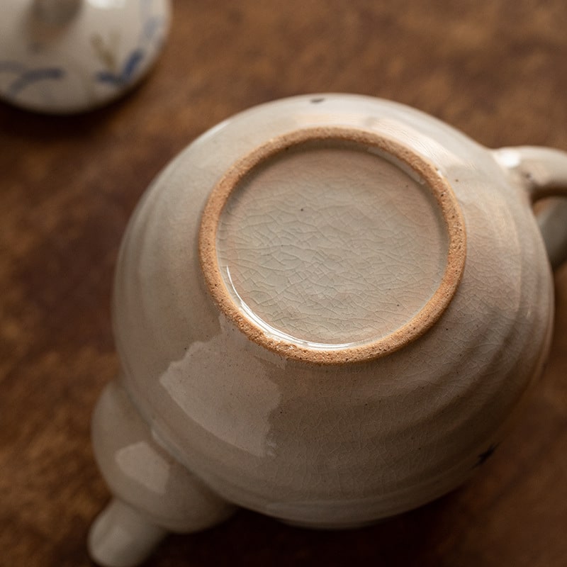 Japanese artisan-crafted ceramic teapot for tea brewing.