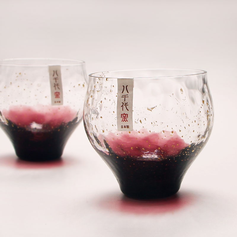 Pair of Japanese handmade starry night glass cups for beverages.