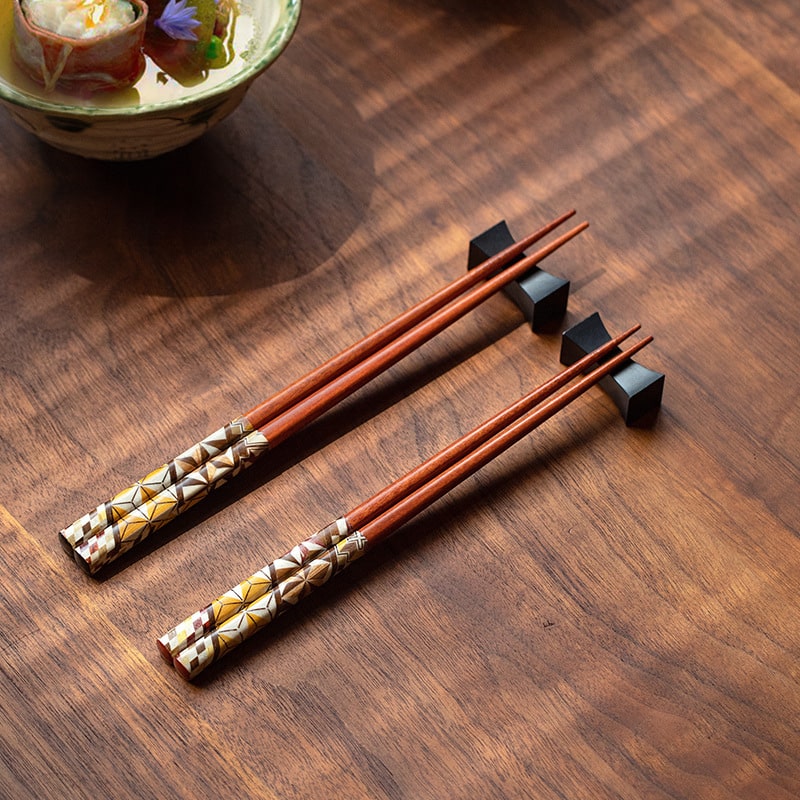 Handcrafted wooden chopsticks with geometric patterns