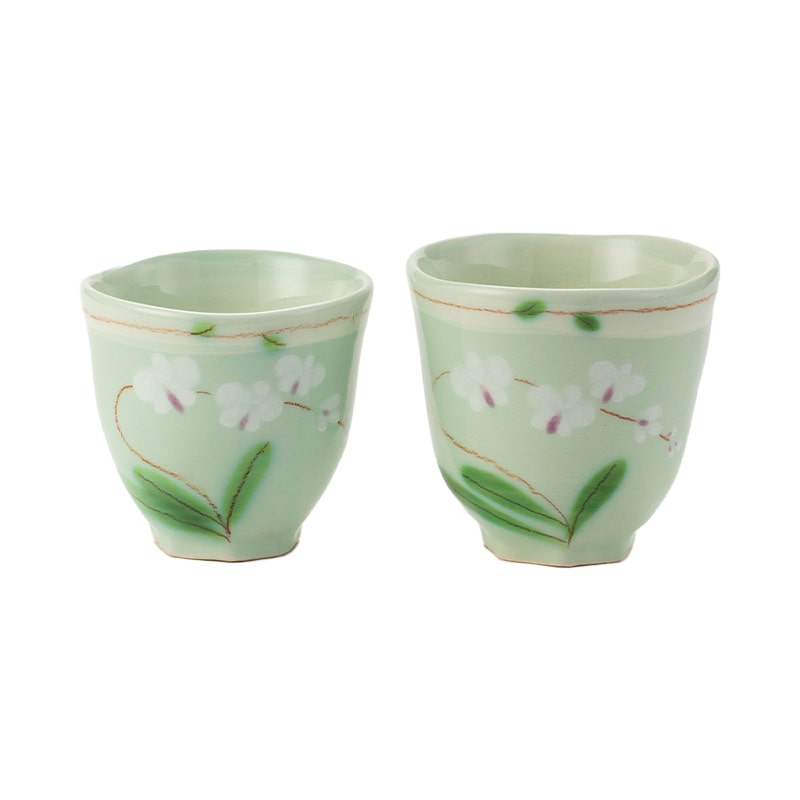 Delicate green floral ceramic tea cup pair