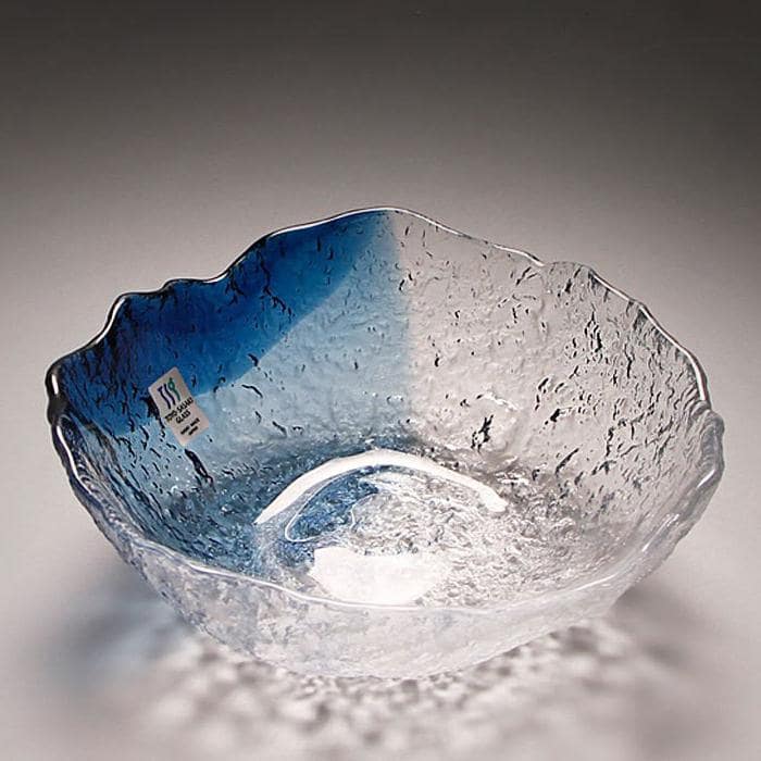 Artistic blue-gradient glass serving bowl with textured edges.