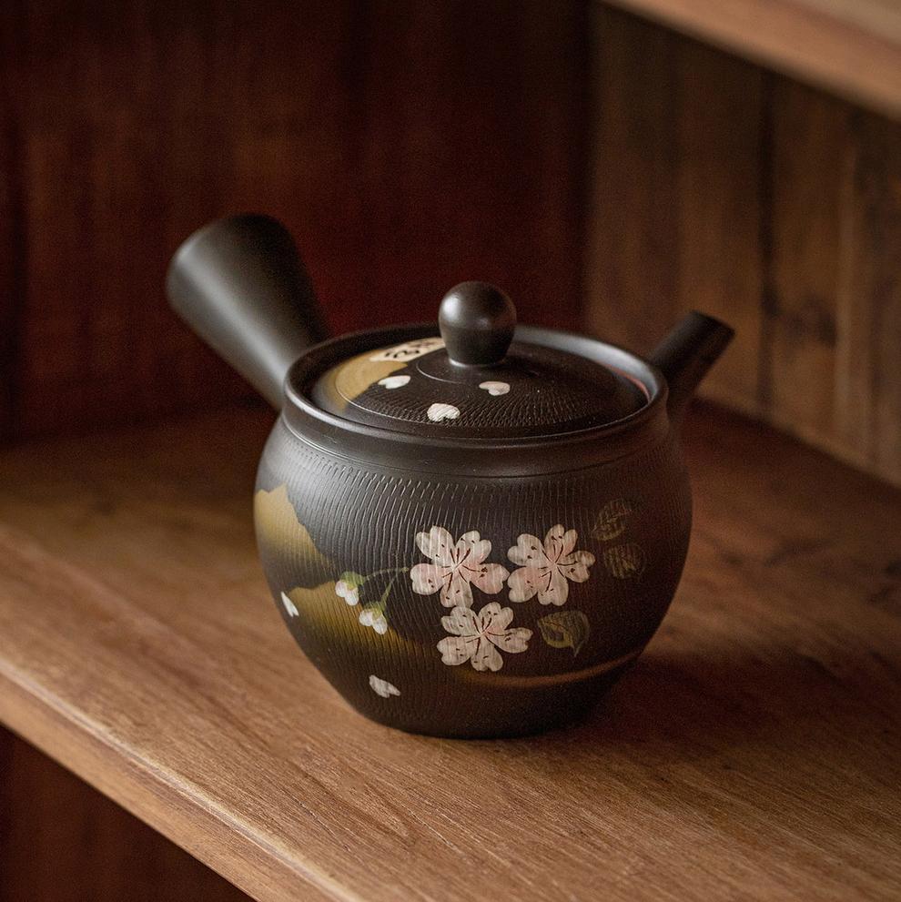 Close-up of cherry blossom design on Japanese teapot