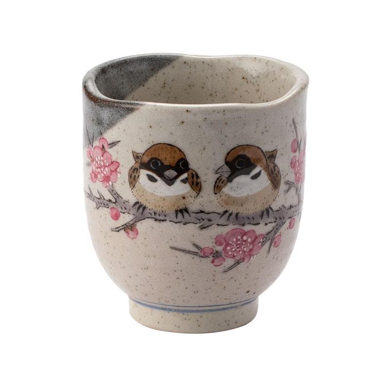 Artisanal ceramic tea cup showcasing spring-inspired details.