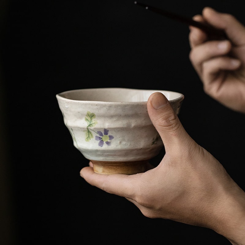 Ceramic bowl filled with soup on a wooden table