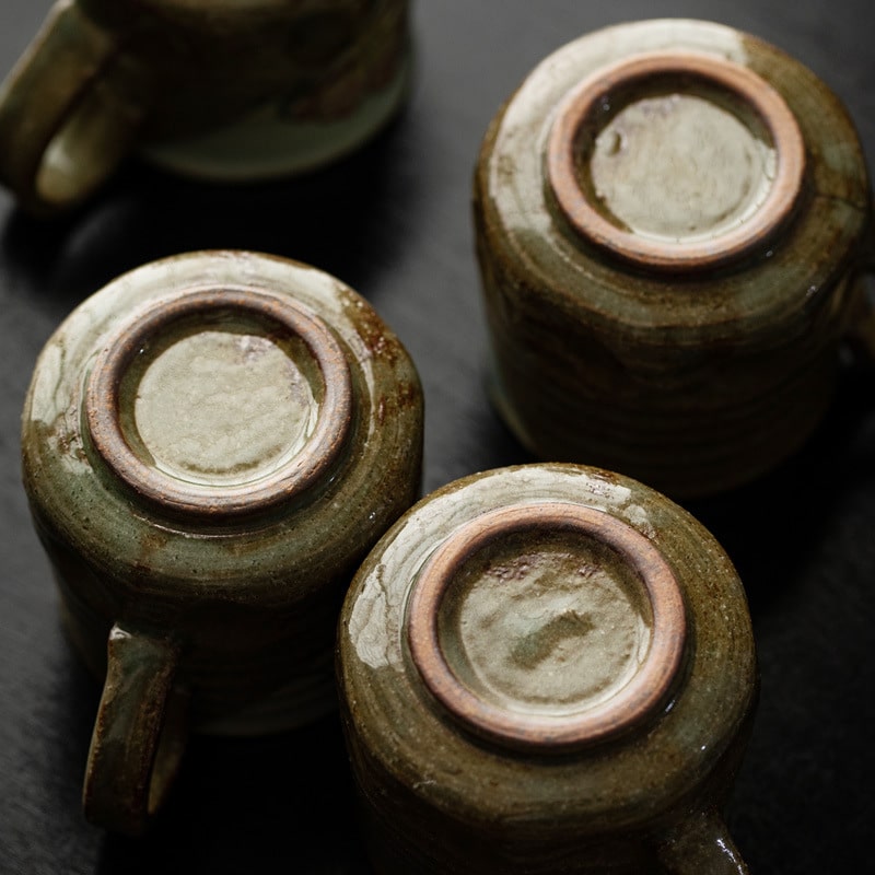 Close-up of a ceramic cup featuring a delicate flower pattern.