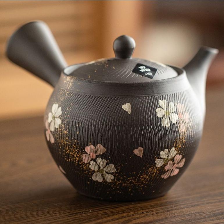 Close-up of cherry blossom design on Japanese teapot