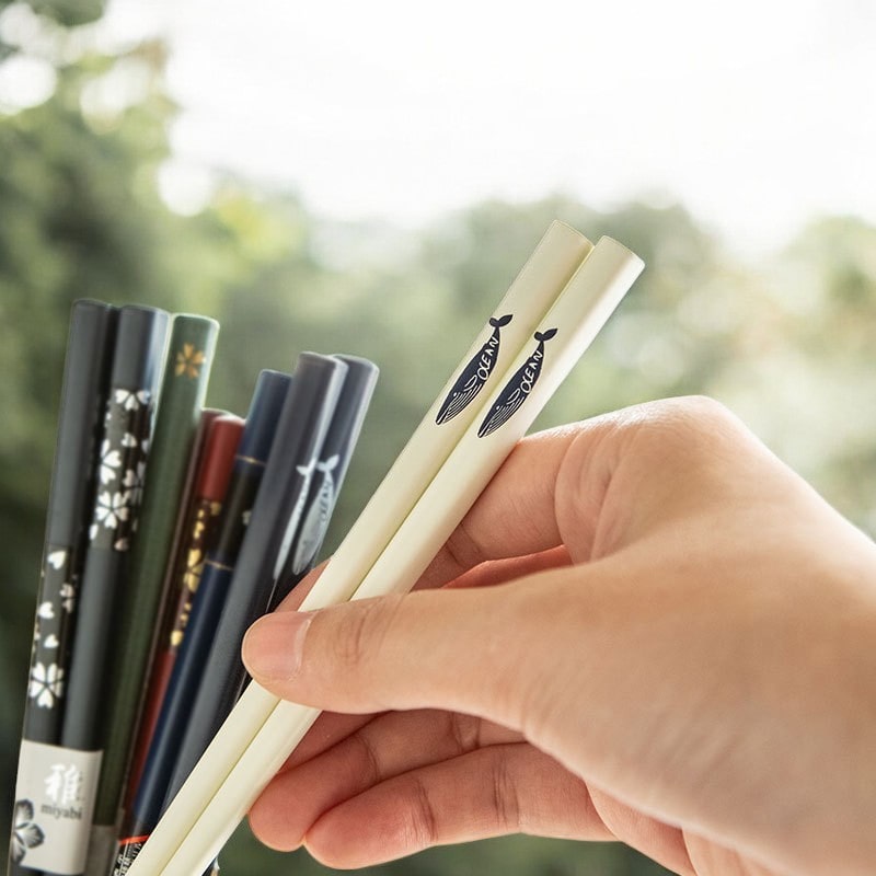 Close-up of reusable chopsticks in black and ivory colors