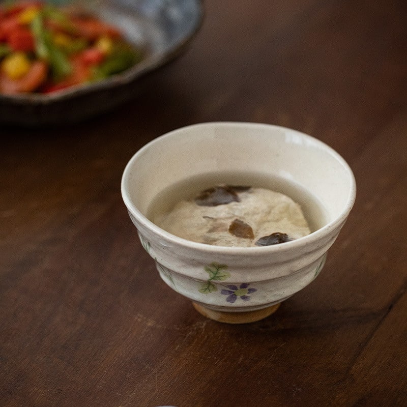 Hand-painted ceramic bowl with pink floral design