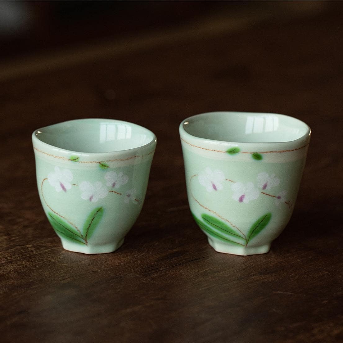 Pastel-striped ceramic coffee cup and saucer set