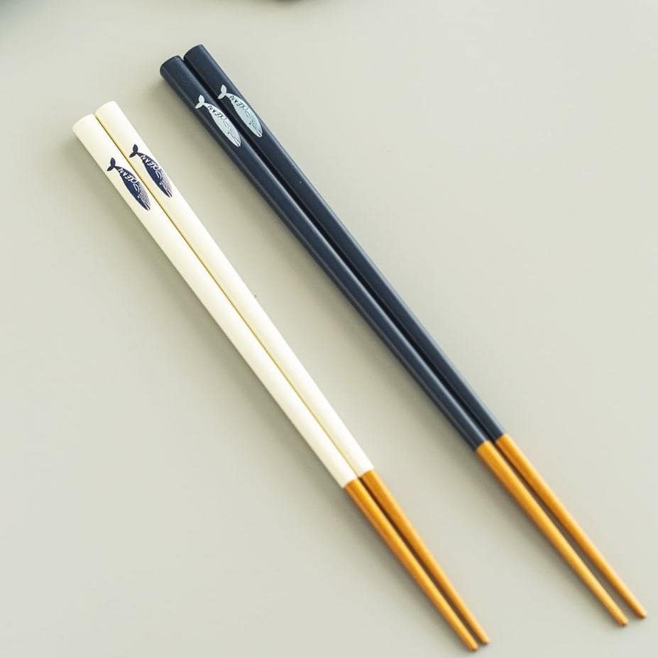 Hand holding ocean-inspired modern Japanese chopsticks