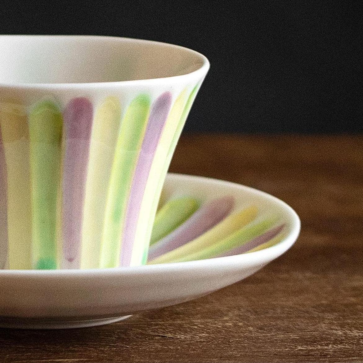 Elegant ceramic tea cups on a wooden table