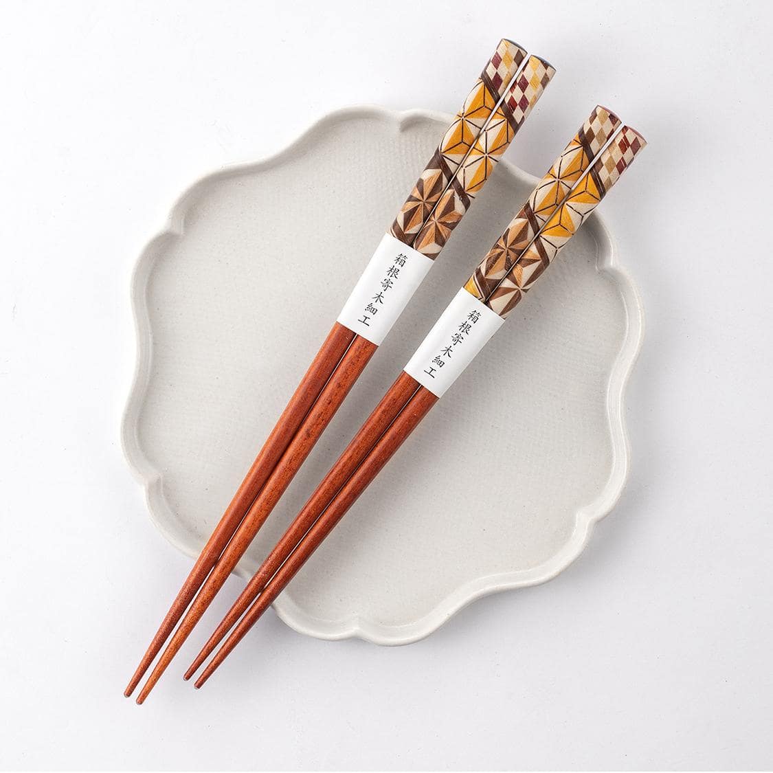 Handcrafted wooden chopsticks with geometric patterns