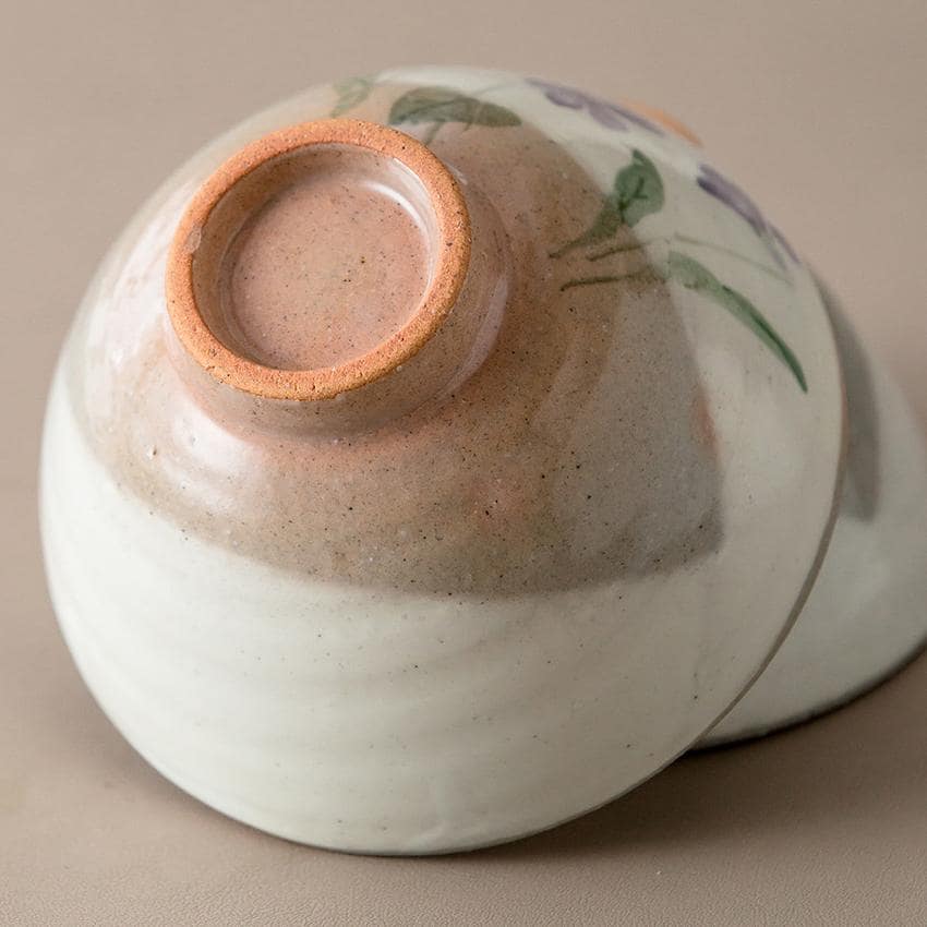 Close-up of handcrafted ceramic bowl with floral motif