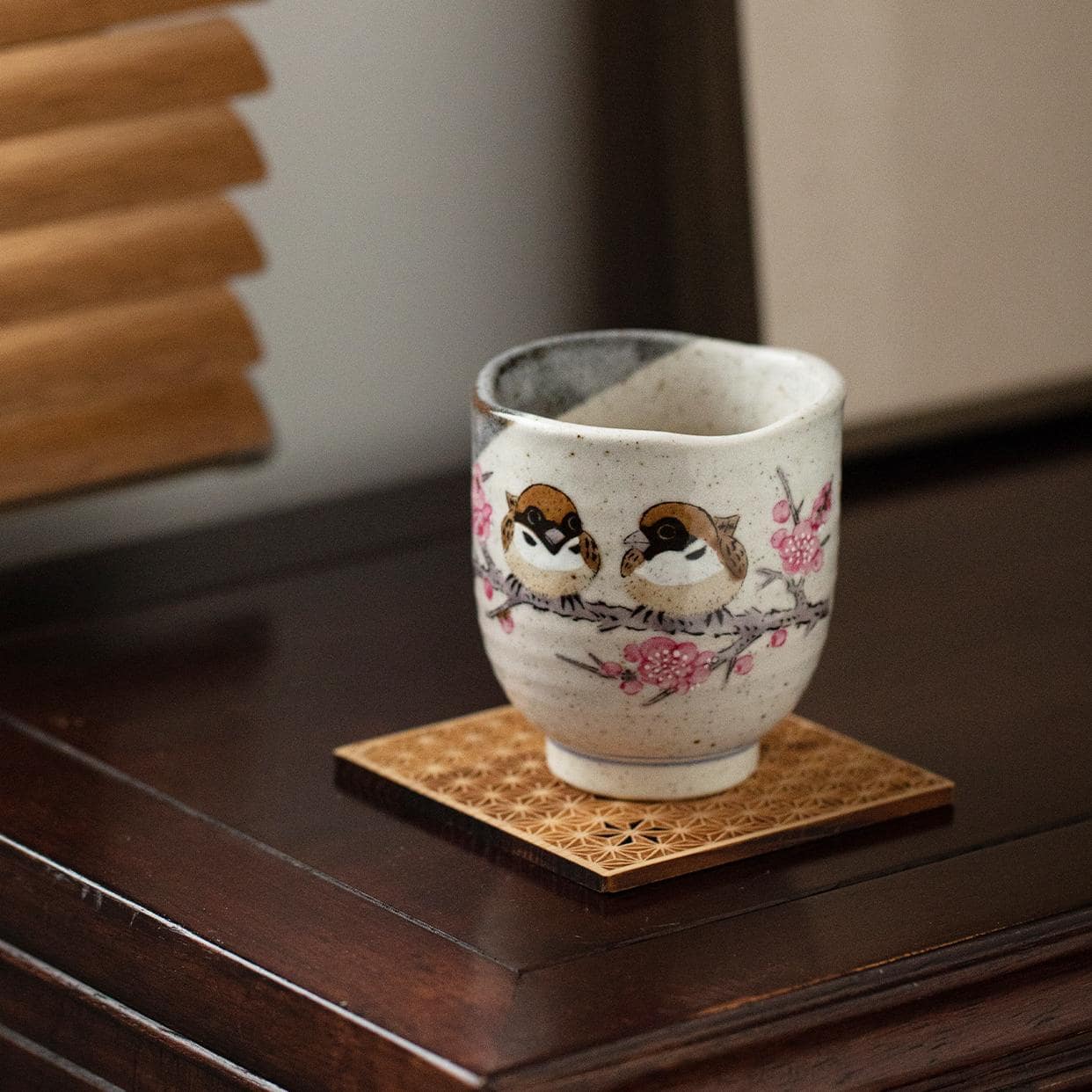 Artisanal ceramic tea cup showcasing spring-inspired details.