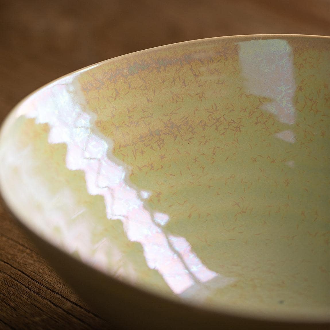 Elegant ceramic bowl held by hands