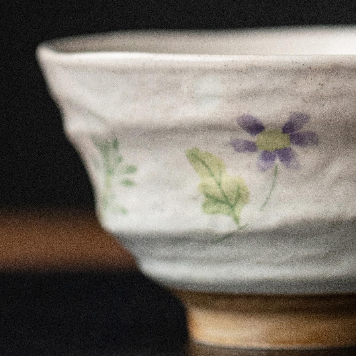 Ceramic bowl filled with soup on a wooden table