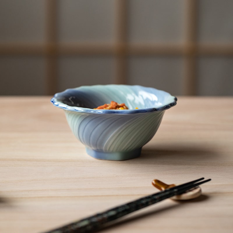 Handcrafted Mino Ware bowl with delicate floral design in pastel hues.