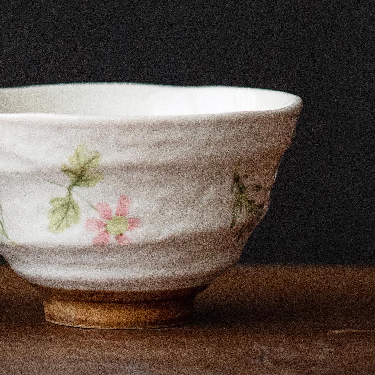 Hand-painted ceramic bowl with pink floral design