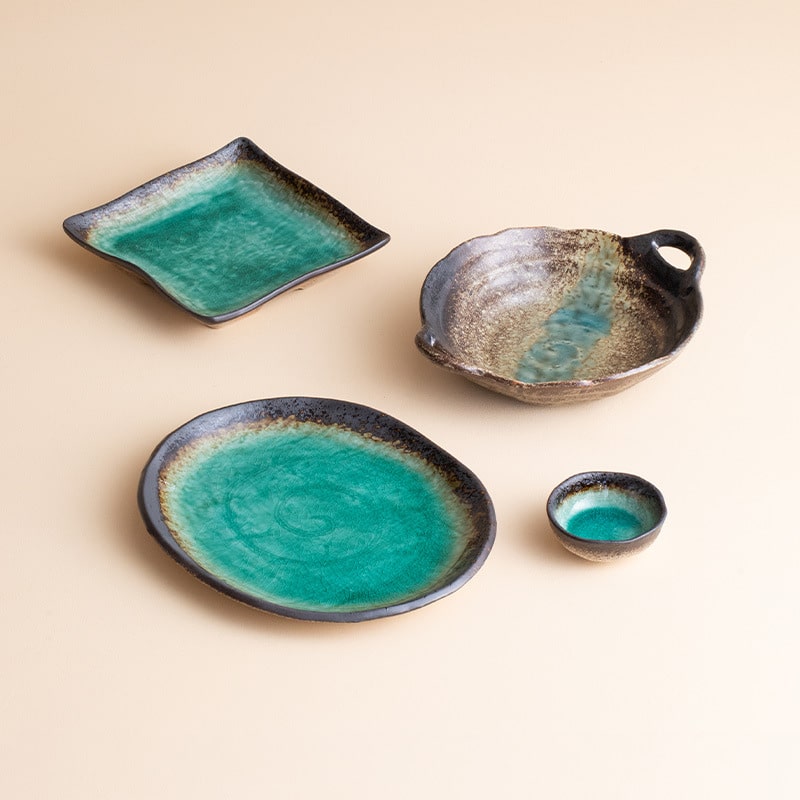 Handcrafted green glazed ceramic plate in turquoise