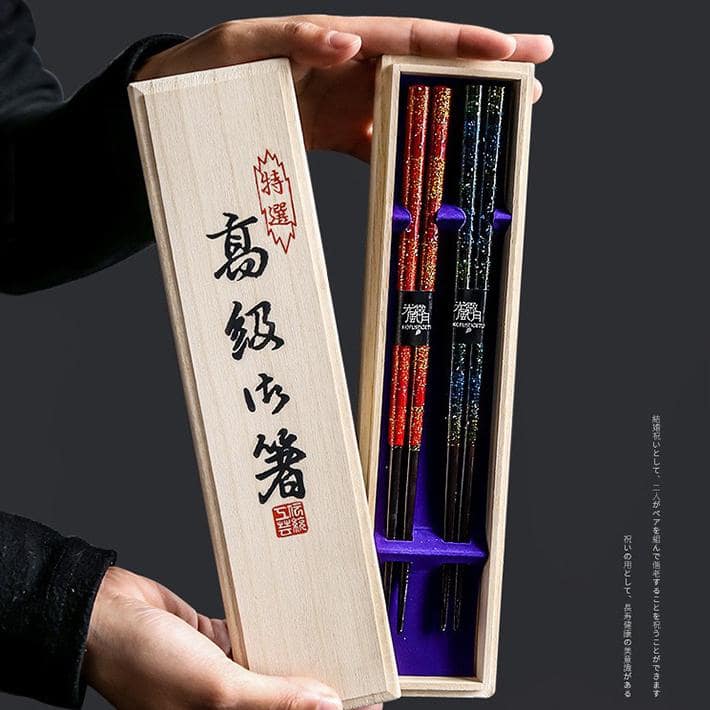 Close-up of sparkling lacquer design on chopsticks