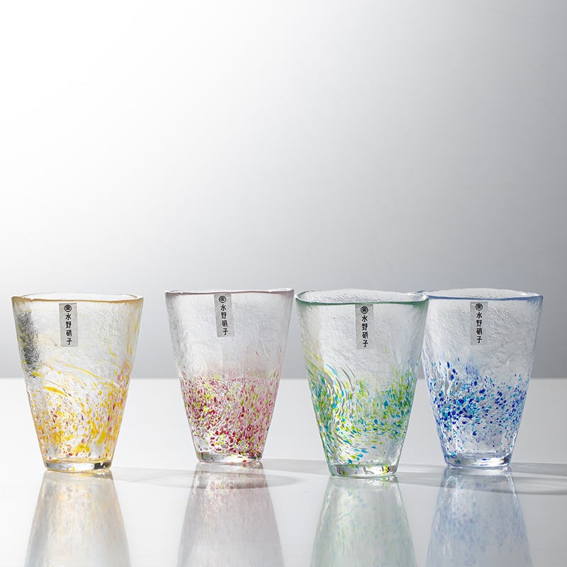 Handcrafted glass tumblers with vibrant swirl patterns