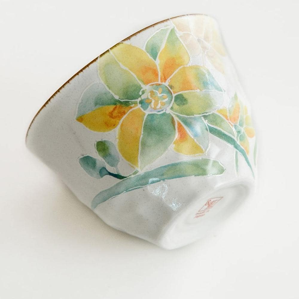 Close-up of hand-painted floral teacup with intricate details