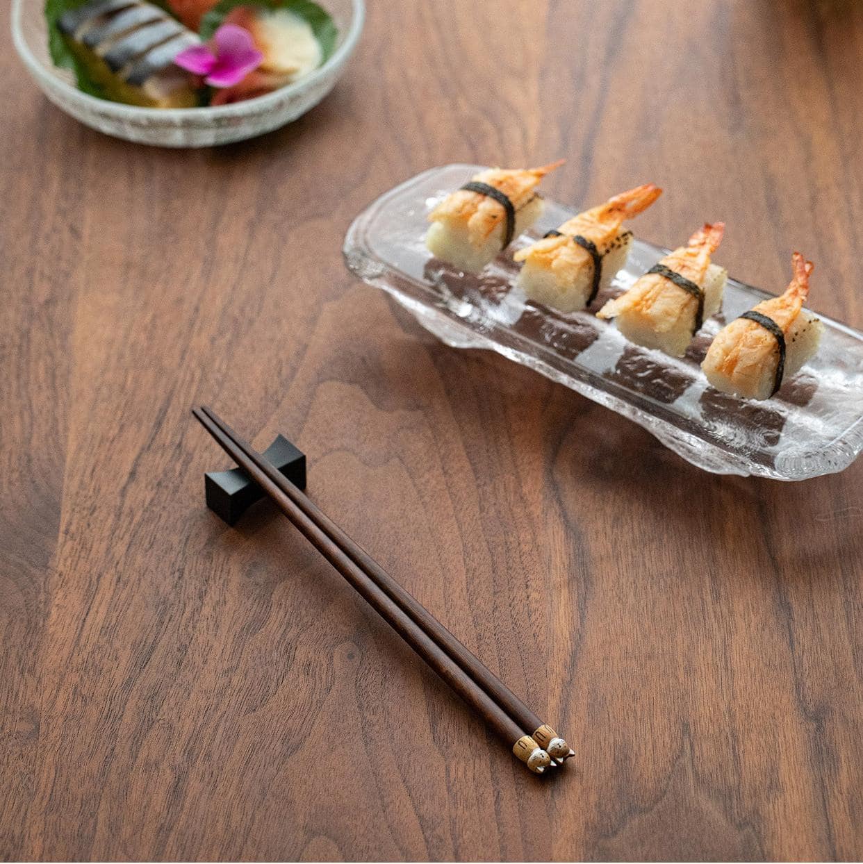 Handcrafted wooden chopsticks displayed in wooden holder