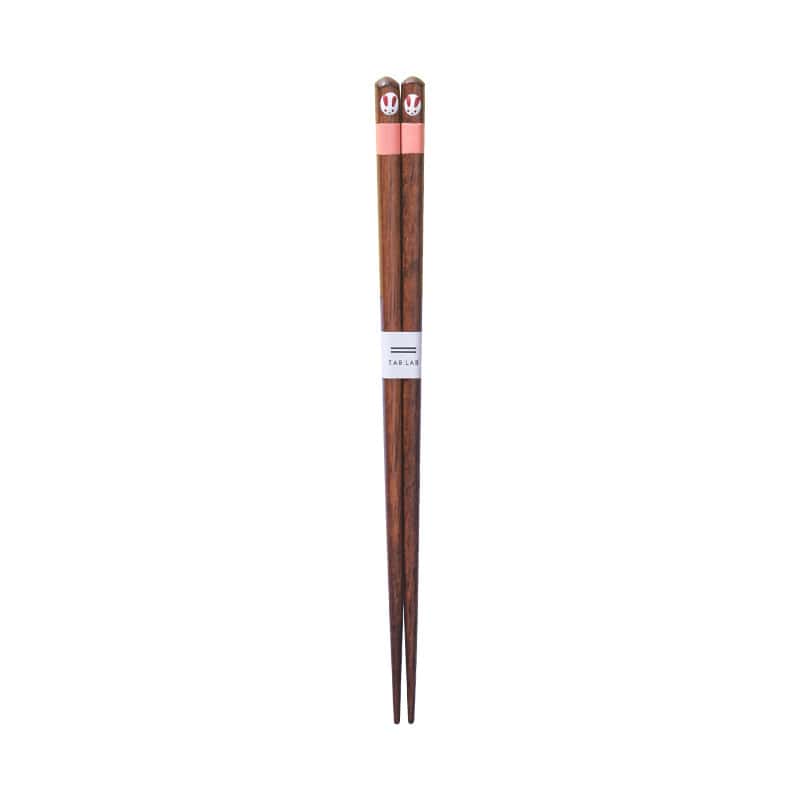 Close-up of hand-painted bunny design on wooden chopsticks