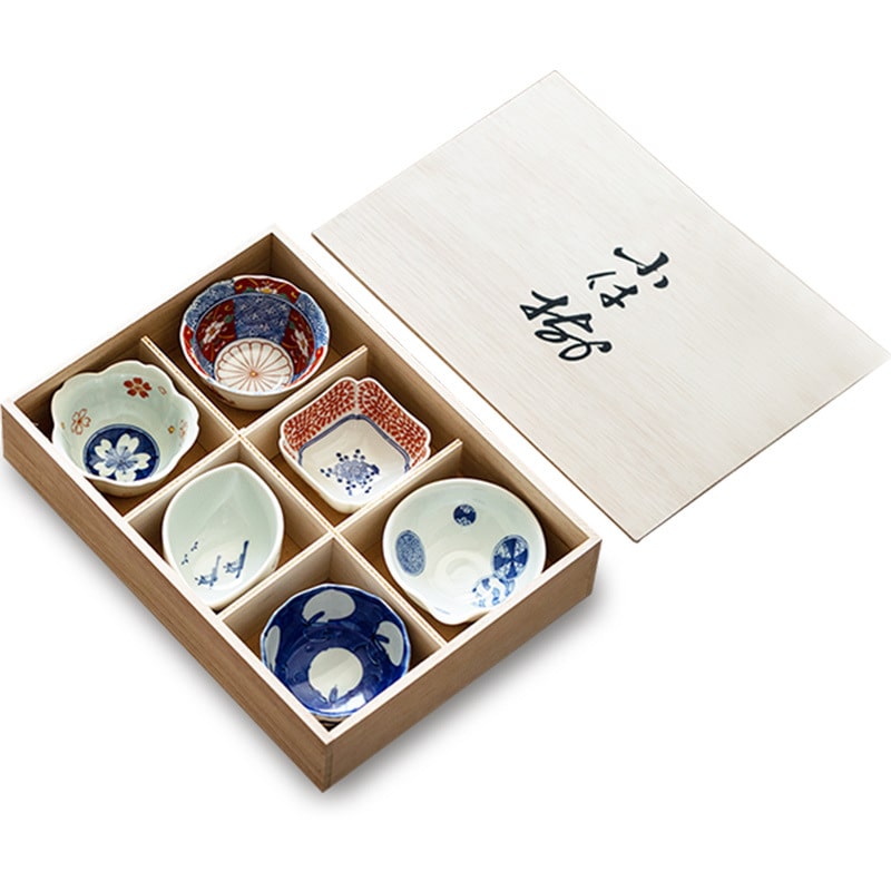 Wooden box showcasing Japanese blue and white bowls