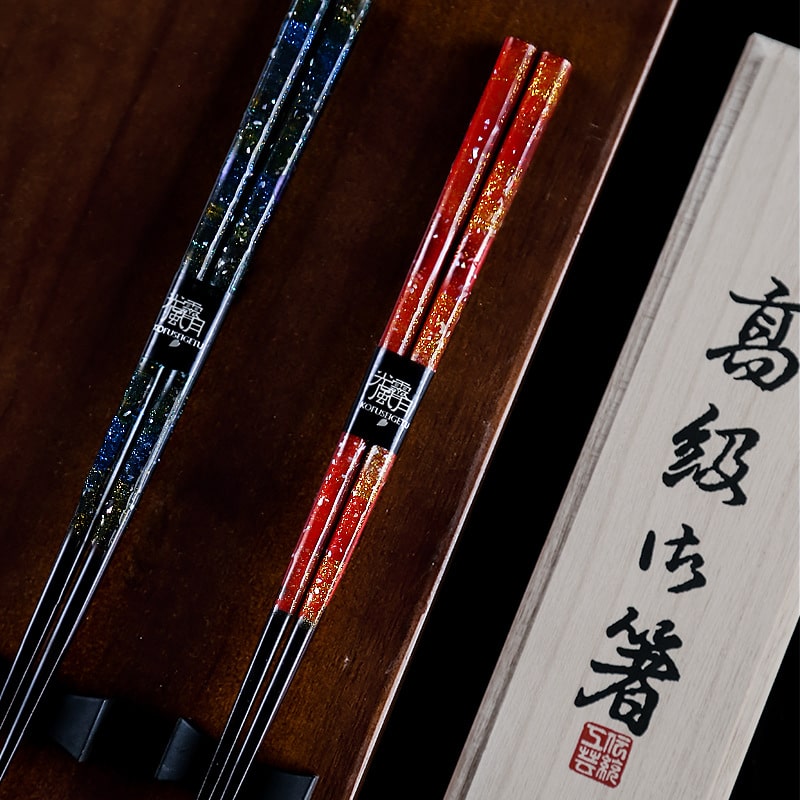 Handcrafted wooden chopsticks with red and blue lacquer finish