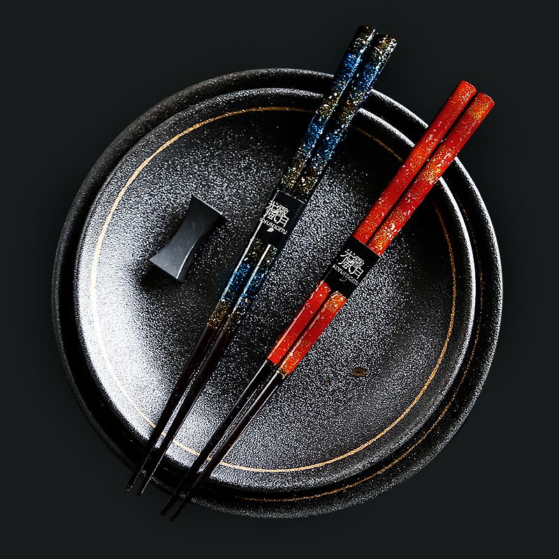 Elegant Japanese chopsticks on a black plate