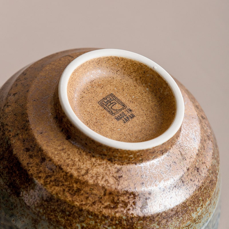 Close-up of artisan bowl bottom stamped with Japanese design