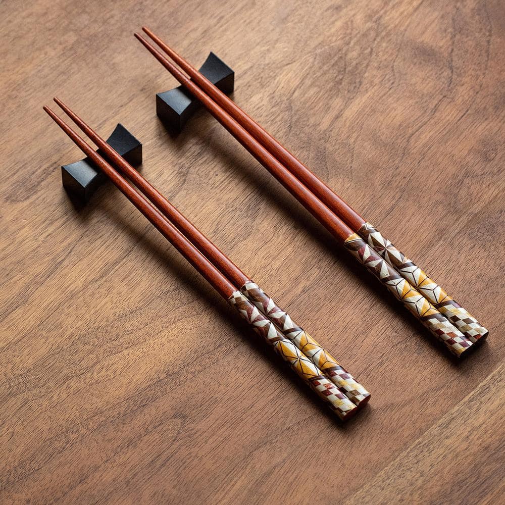 Handcrafted wooden chopsticks with geometric patterns