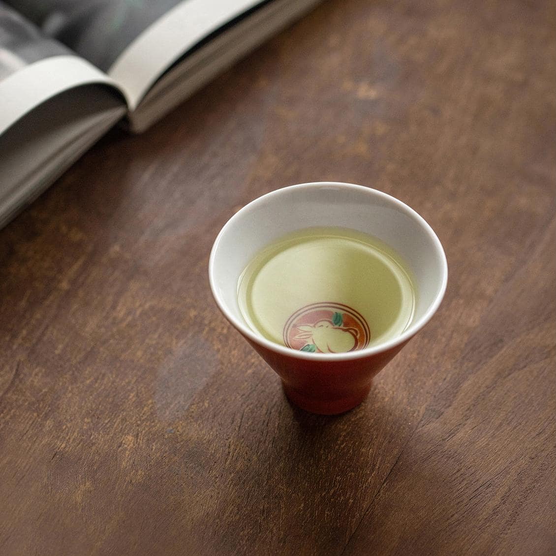 Intricate rabbit illustration on porcelain teacup lid