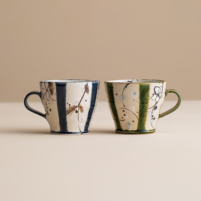 Rustic Japanese ceramic teacups in earthy blue and green tones