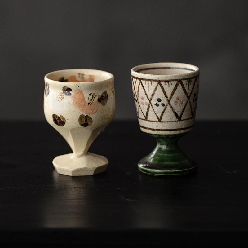 Pair of handcrafted ceramic cups with intricate designs