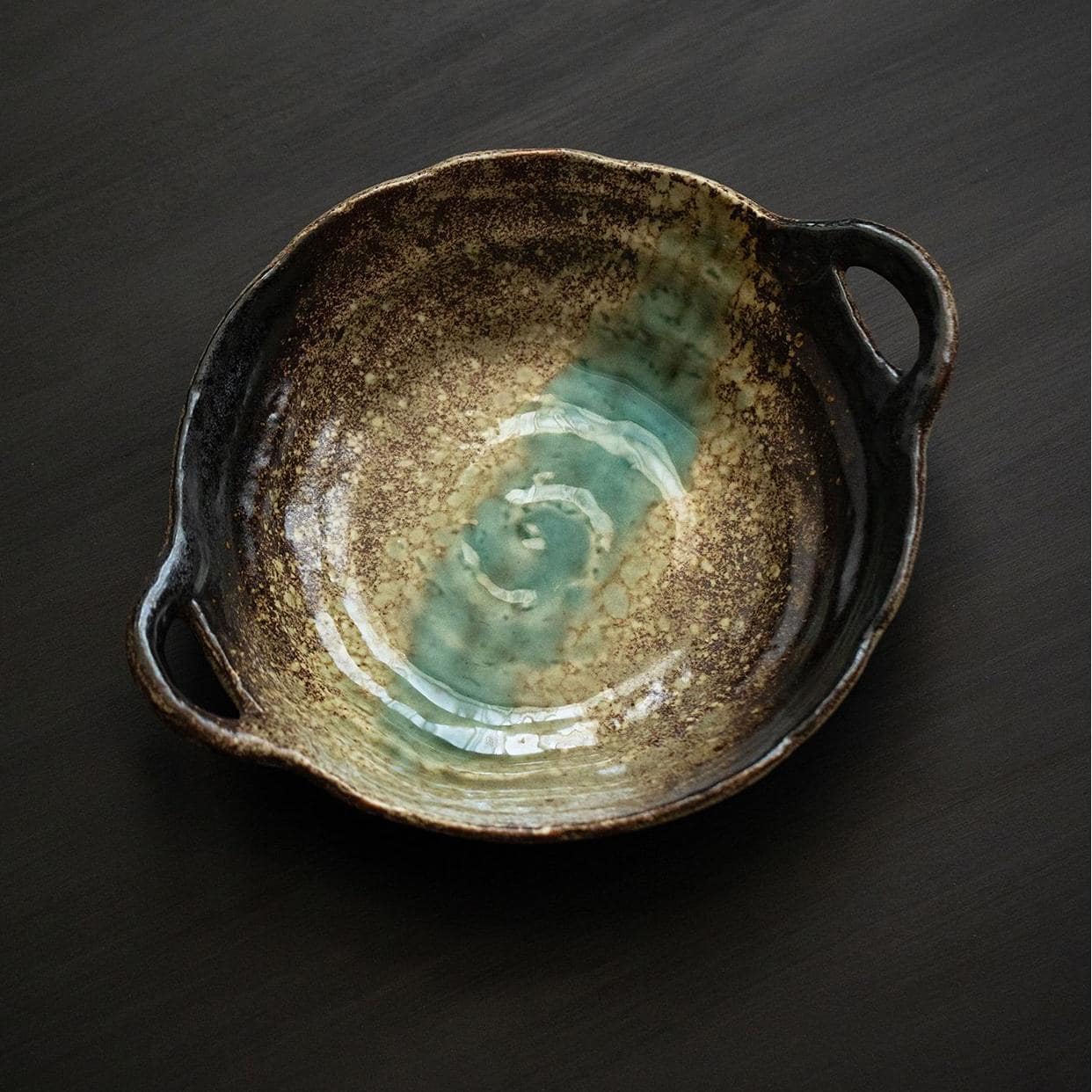 Durable ceramic serving bowl with green accents