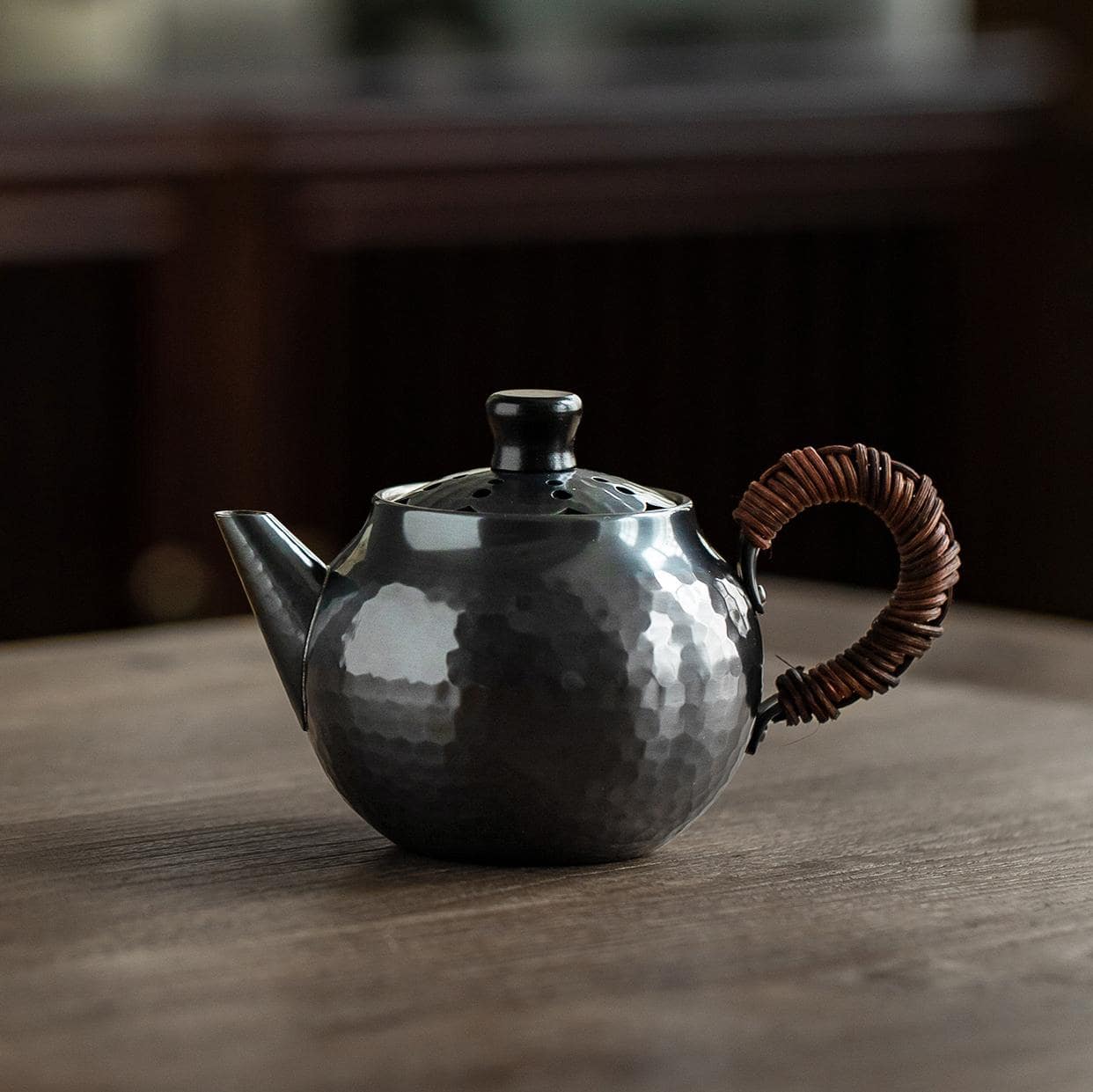 Close-up of the elegant lid design on a copper kettle