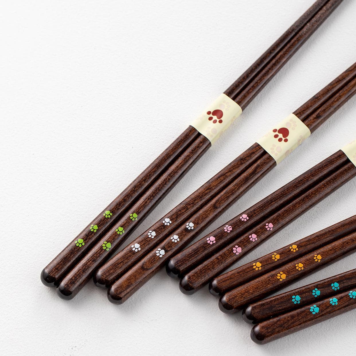 Close-up of paw print details on wooden chopsticks