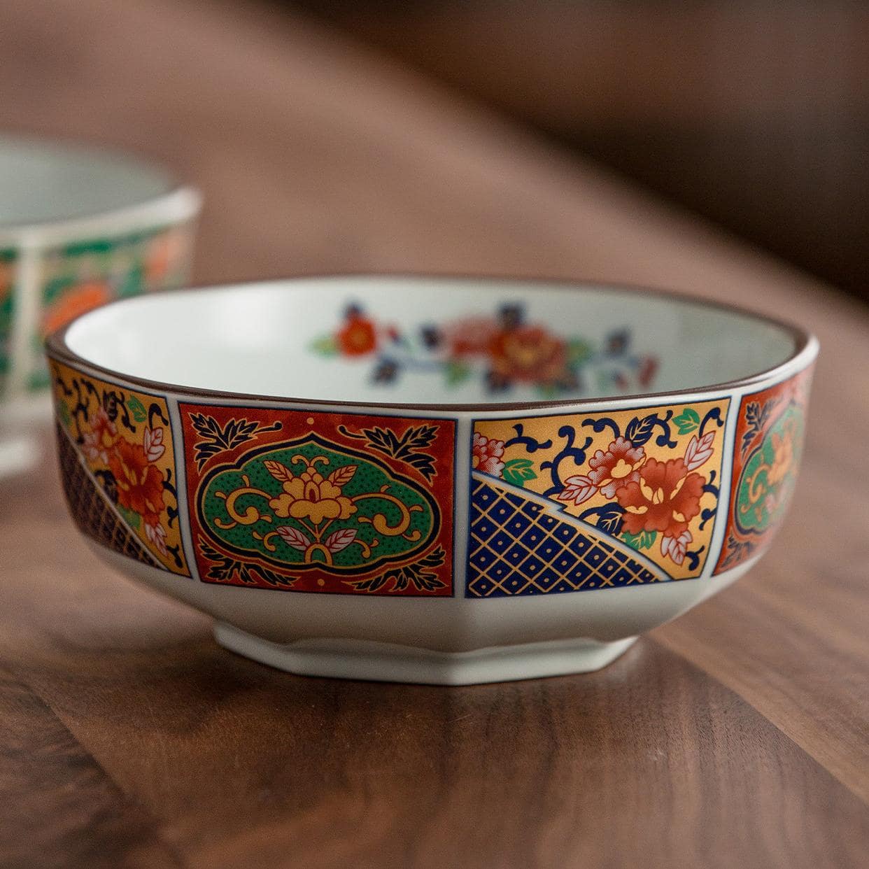 Set of five ceramic soup bowls with intricate Japanese designs.