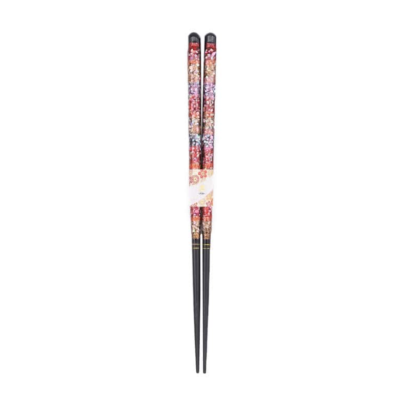 Luxurious black chopsticks with gold and red detailing.
