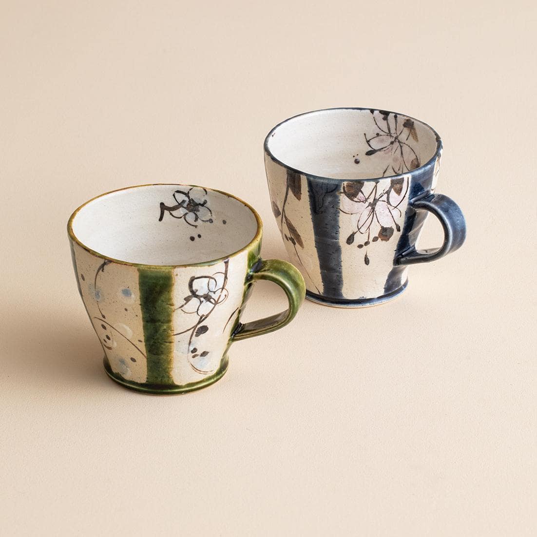 Rustic Japanese ceramic teacups in earthy blue and green tones