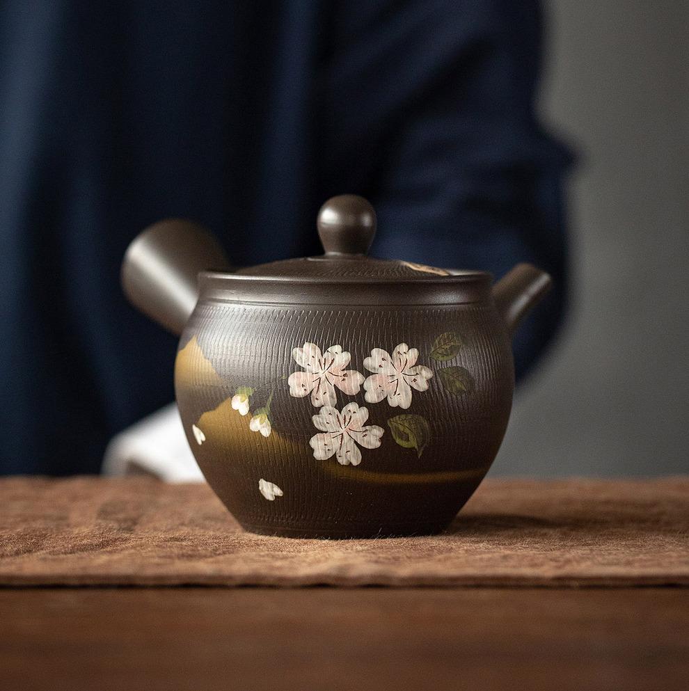 Elegant Japanese teapot on a wooden shelf