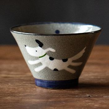 Handcrafted ceramic bowls with playful dog design