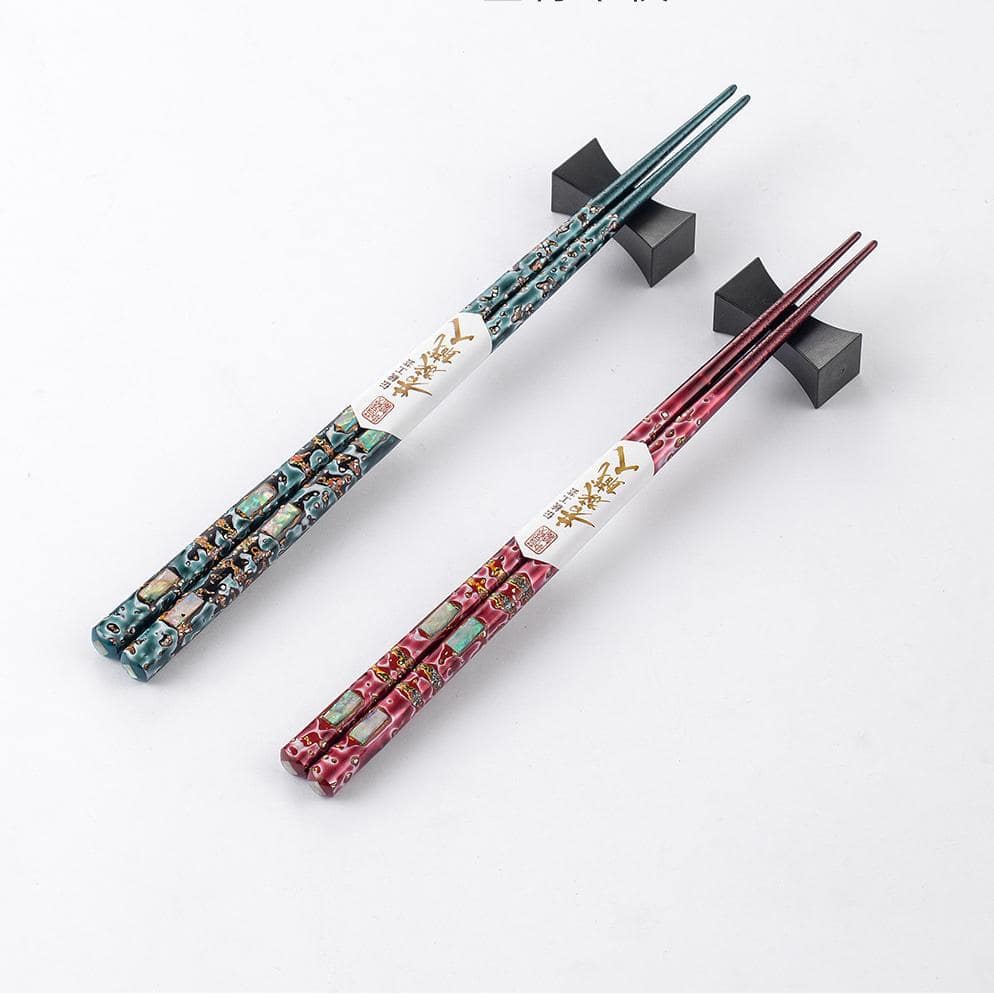 Close-up of ergonomic Japanese wooden chopsticks showcasing intricate patterns.