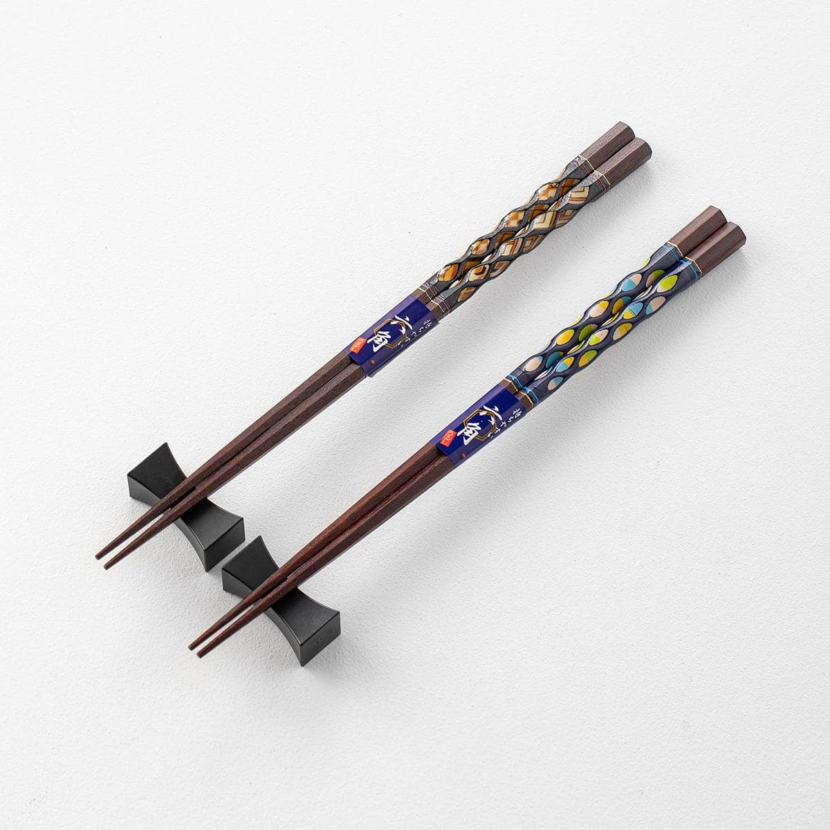 Close-up of Japanese Ishida solid wood chopsticks with intricate designs.