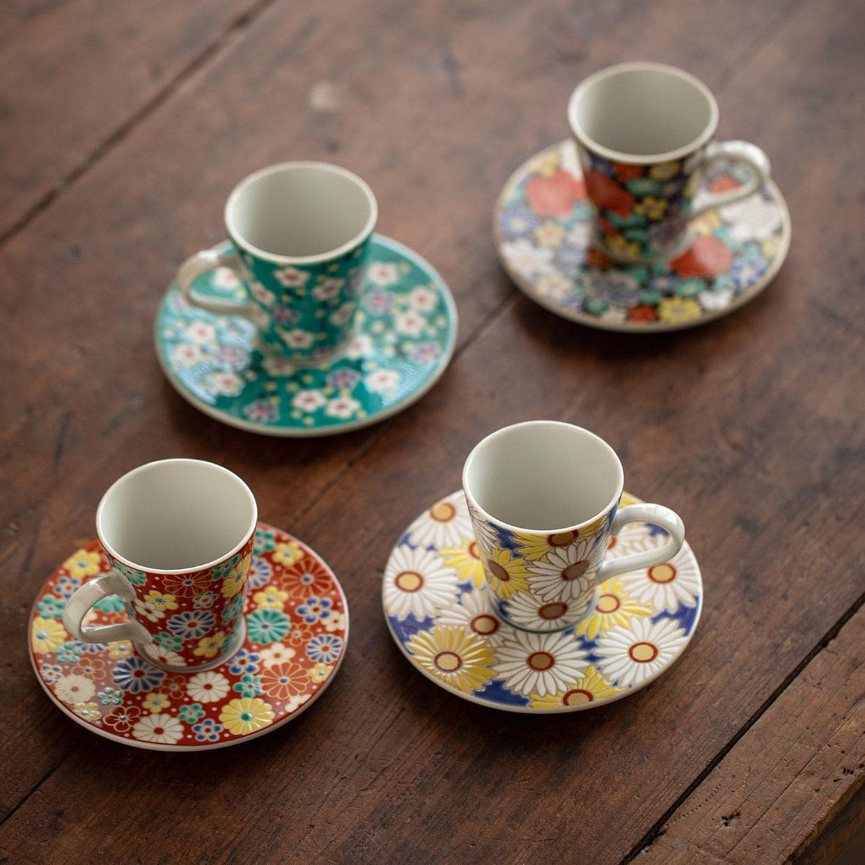 Floral espresso cup set with colorful saucers