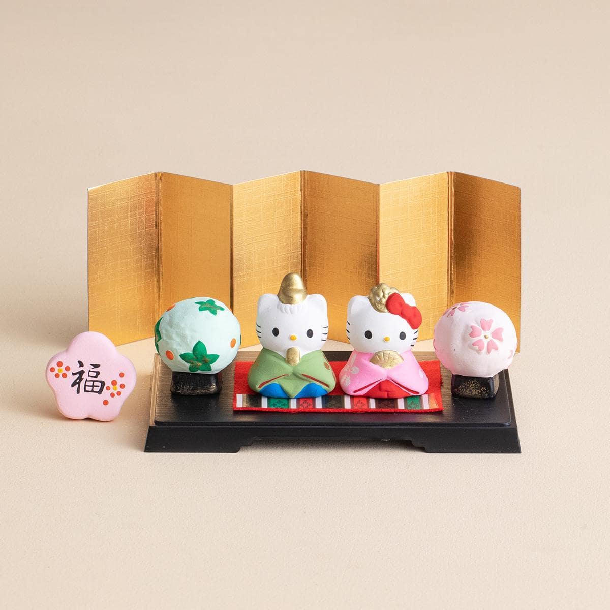 Hello Kitty couple ceramic ornaments with a golden folding screen backdrop